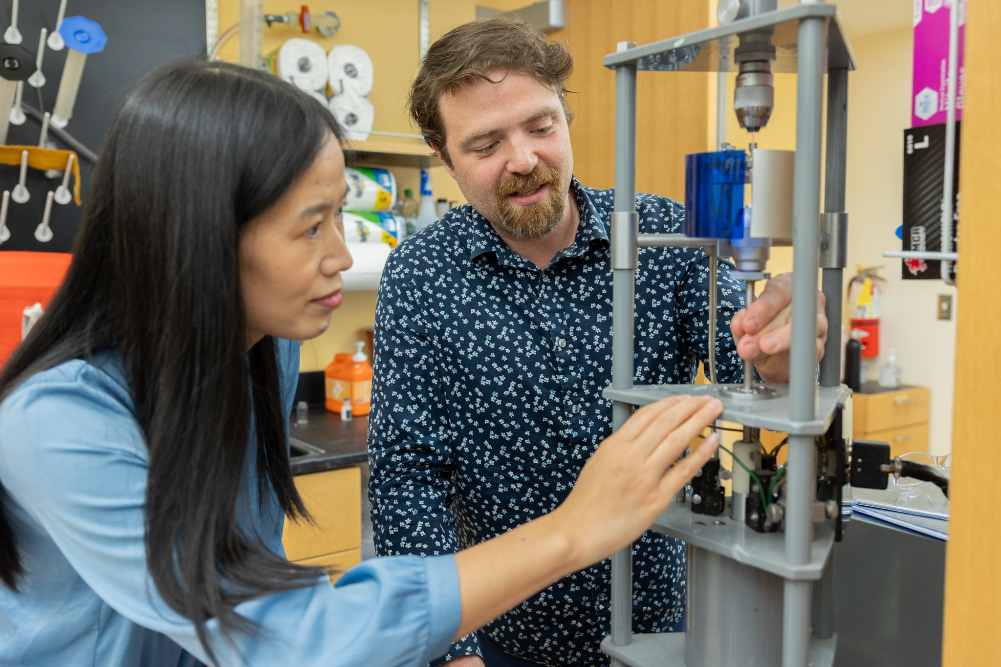 (From left) Xiaoting Jia and Dan English work in the Center for Photonics Technology. Photo by Ben Murphy for Virginia Tech.