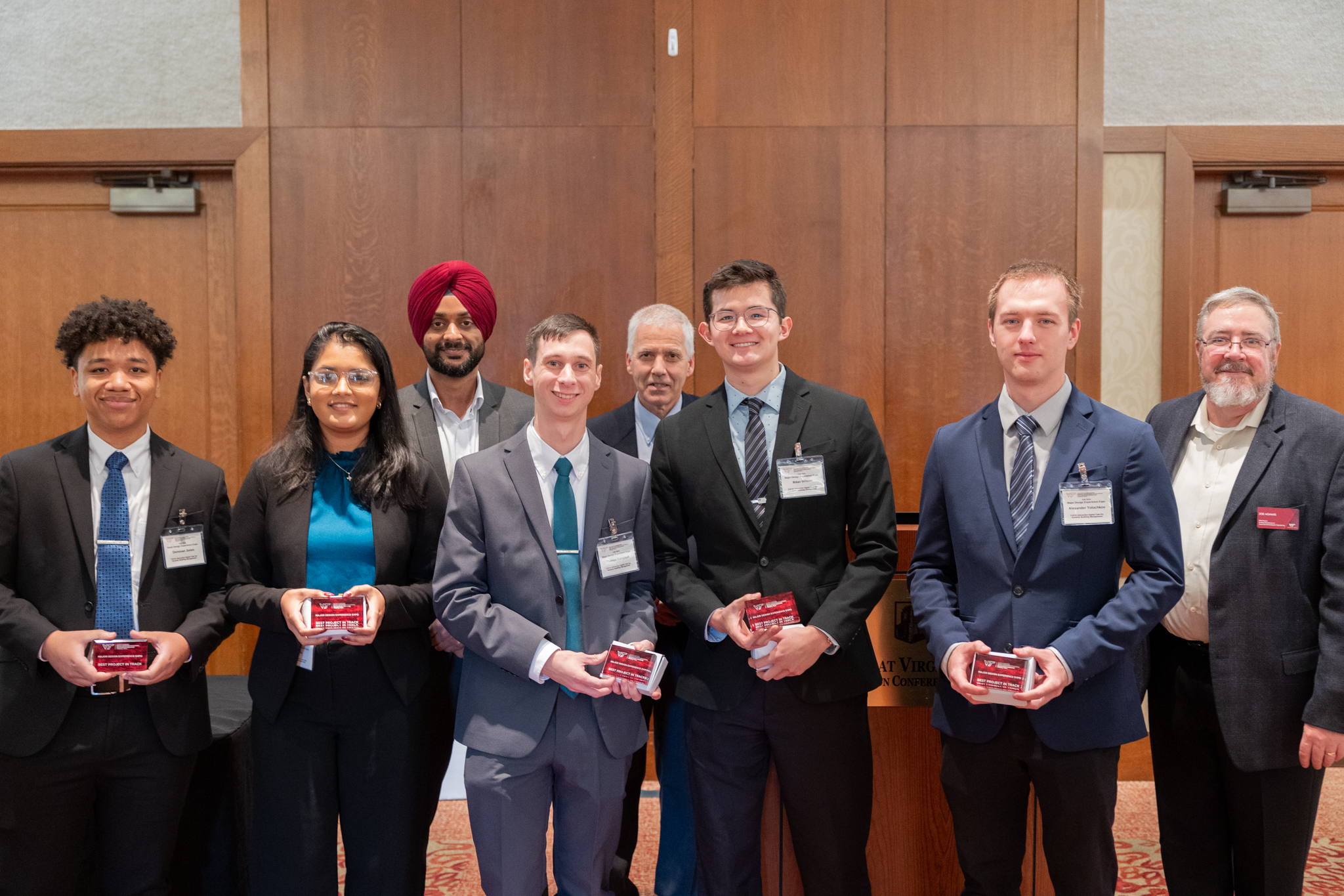 From left: Donovan Jones, Riya Parikh, Harpreet Dhillon, Thomas Campbell, Daniel Connors, Riker Wilson, Alexander Tolochkov, and Joe Adams