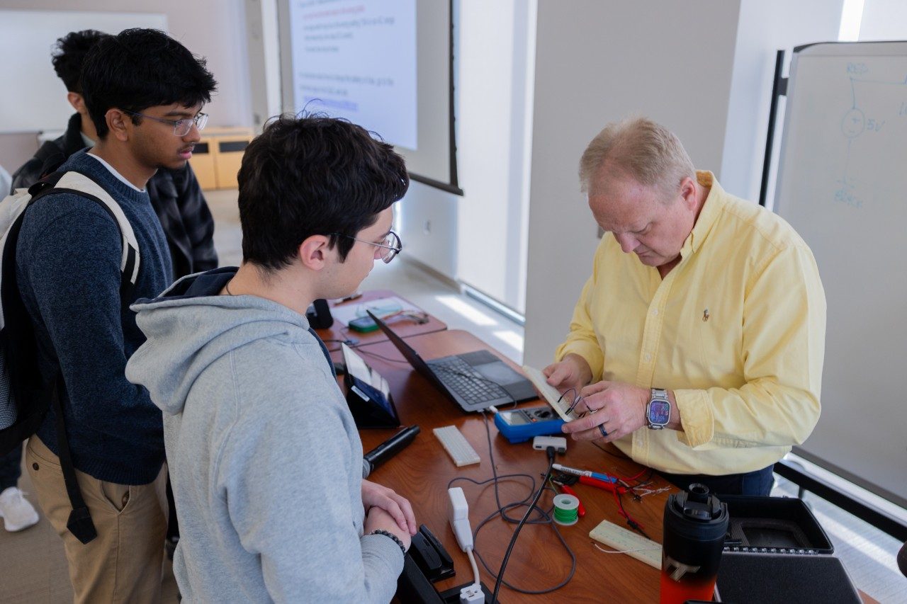 Scott Dunning works with a student on the AD3