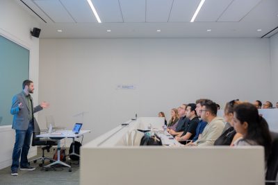 ECE alumni Zach Rattner gives his presentation to a packed room of the Virginia Tech Research Center