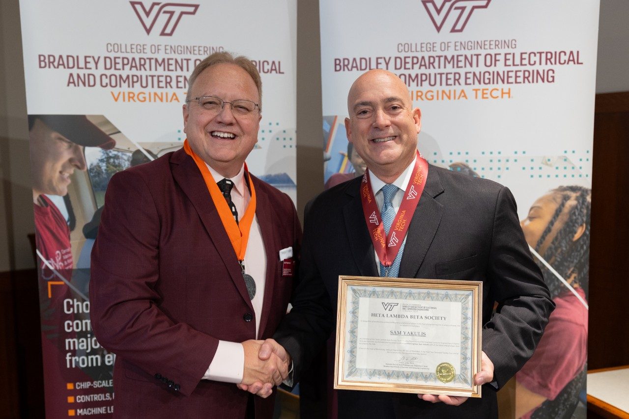 From left: Associate department head Scott Dunning and Sam Yakulis at the Heta Lambda Beta ceremony. Photo by Ben Murphy for Virginia Tech.