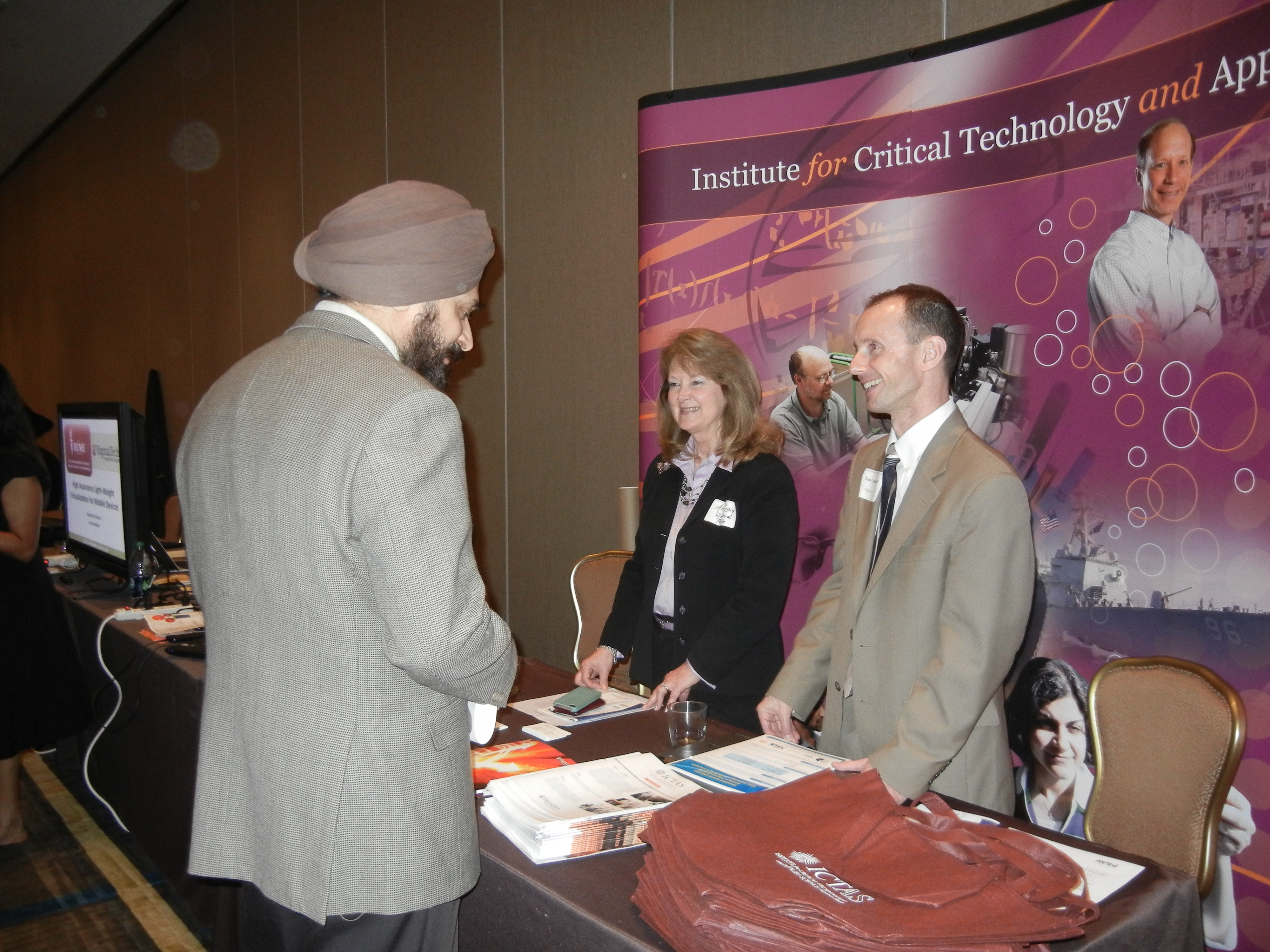 Ann Craig and Tom Campbell at ICTAS booth at technology exhibit