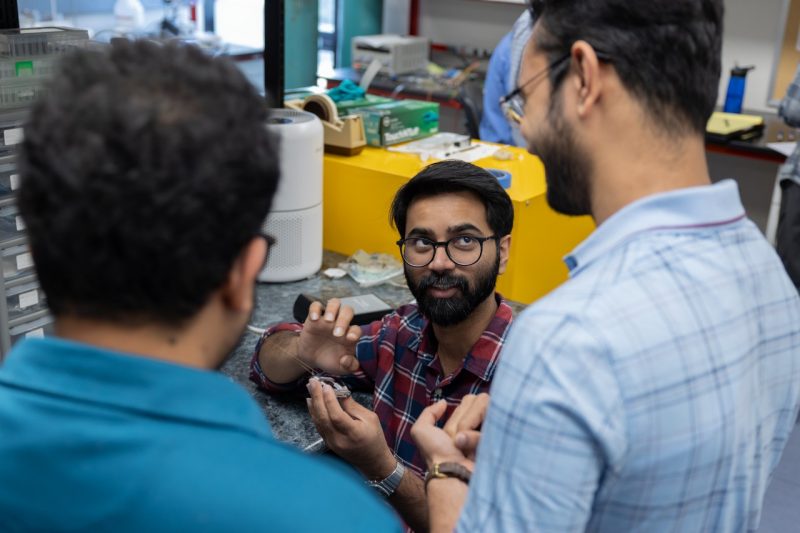 From left: Mustahsin Chowdhury, Nipun Thamatam, Suman Dewanjee work together on SPOCK.