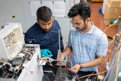 Vikas Goel (post doc at Gabriel's lab) and Suman Dewanjee working on the aerosol impactor