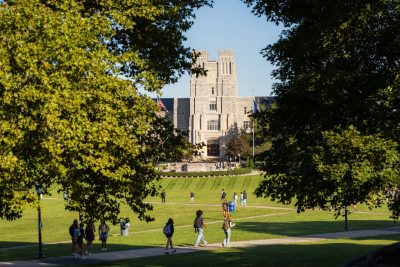 people walk along the Drillfield
