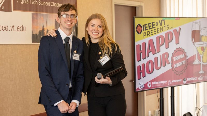 Nolan Donovan and Madalyn Killian pose for a photo at the IEEE happy hour social event