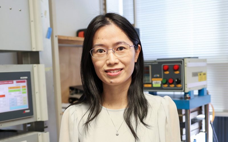 Xiaoting Jia with her lab equipment behind her. 