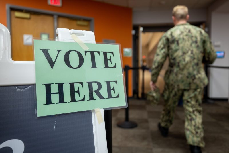 A voter makes their way into one of three precinct polling locations in Squires Student Center on election day.